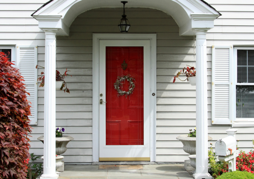 red door on white house