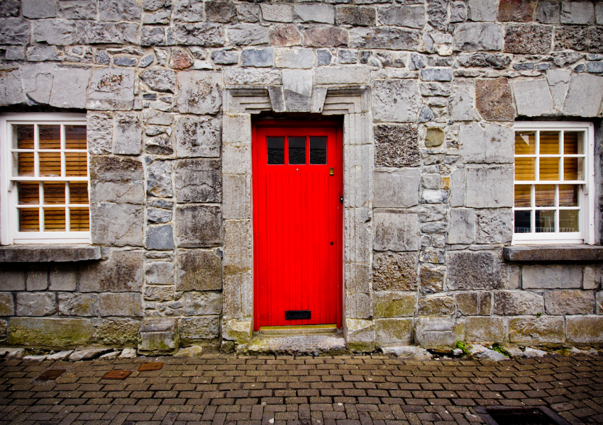 Red door on brick wall