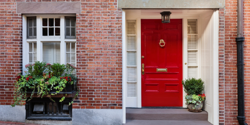 Red door on a brick wall